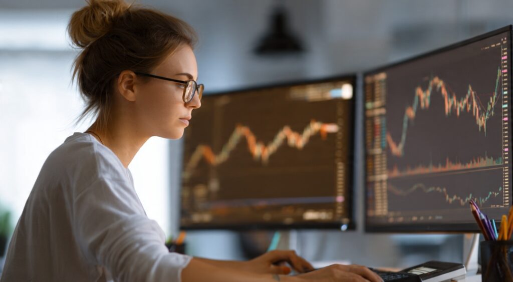 Trader calculating position size with discipline — respecting trading capital.