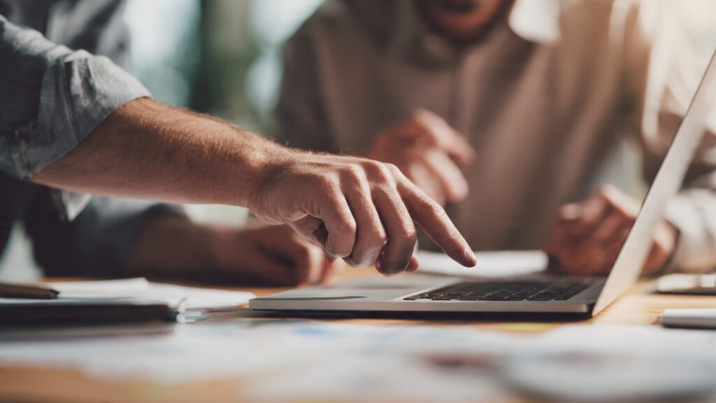 Startup zero cost team strategy — founder focusing on sales while delegating admin tasks to trusted team member
